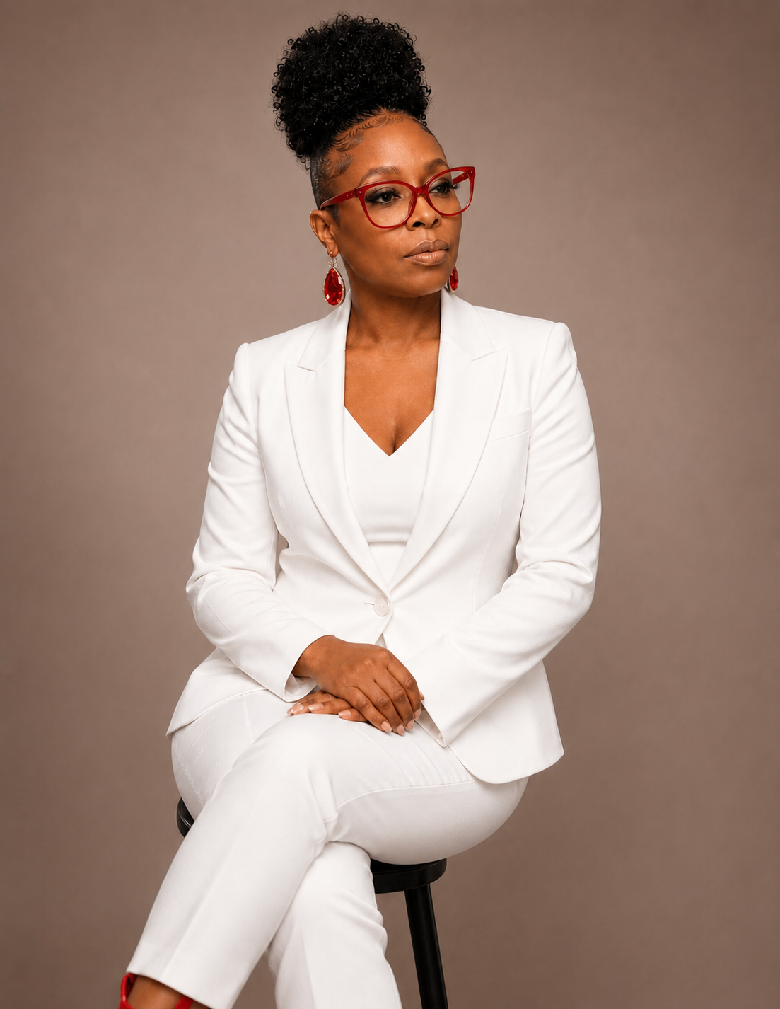 Kammeshia Davis, Senior Licensed Life Insurance Advisor and founder of Polly C. Protection, in a white suit
